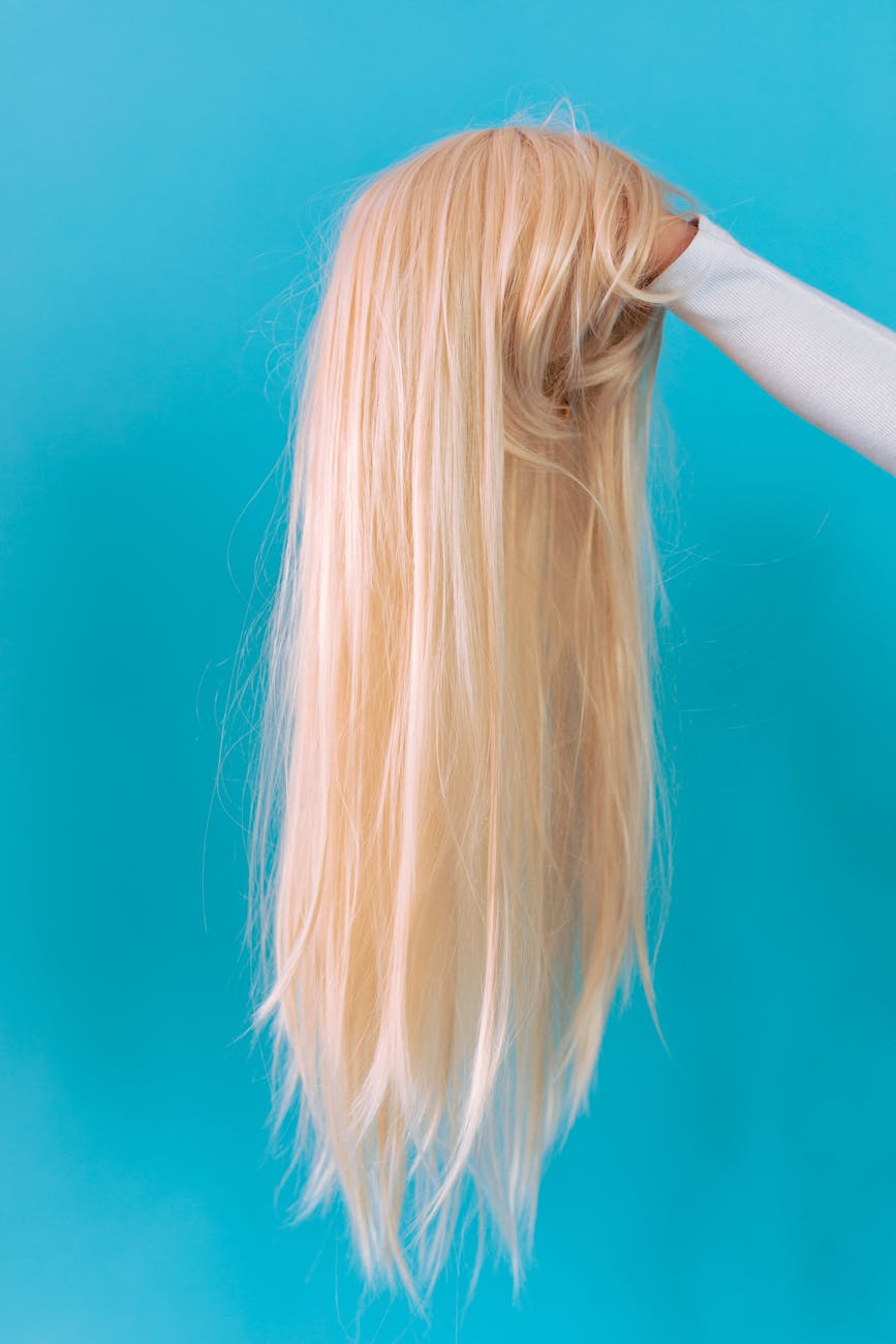 blonde haired woman in blue sleeveless top